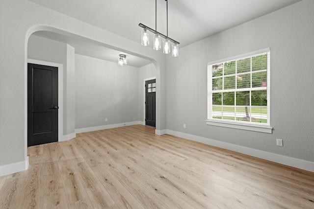 spare room with light wood-type flooring