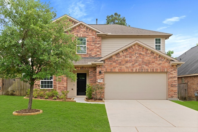 view of front facade featuring a garage and a front yard