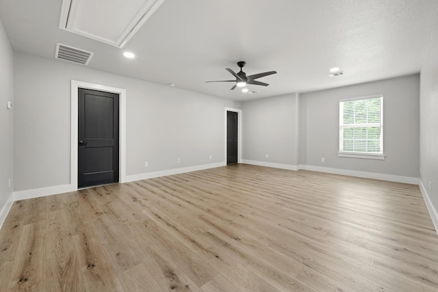 spare room with ceiling fan and light hardwood / wood-style floors