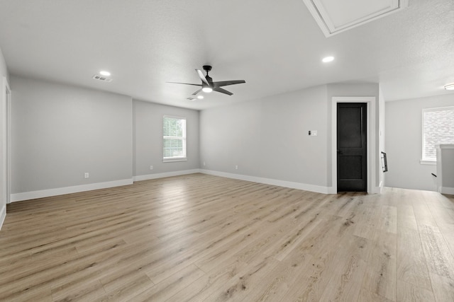 unfurnished room featuring light hardwood / wood-style flooring and ceiling fan