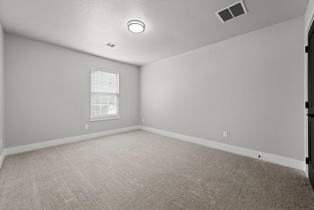 unfurnished room featuring carpet floors