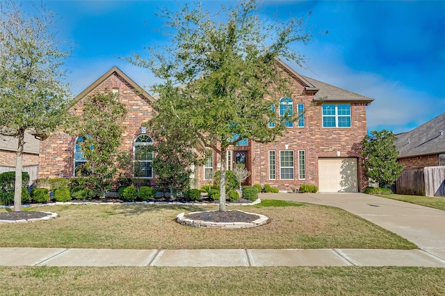 view of front property with a front yard and a garage