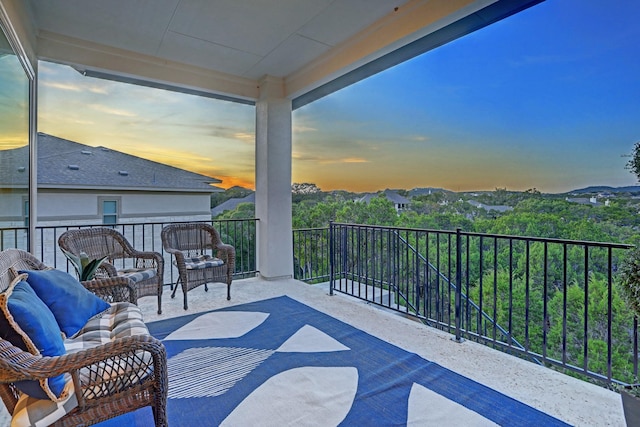 balcony at dusk with outdoor lounge area