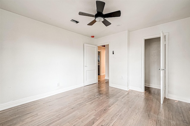 unfurnished bedroom featuring ceiling fan and light wood-type flooring