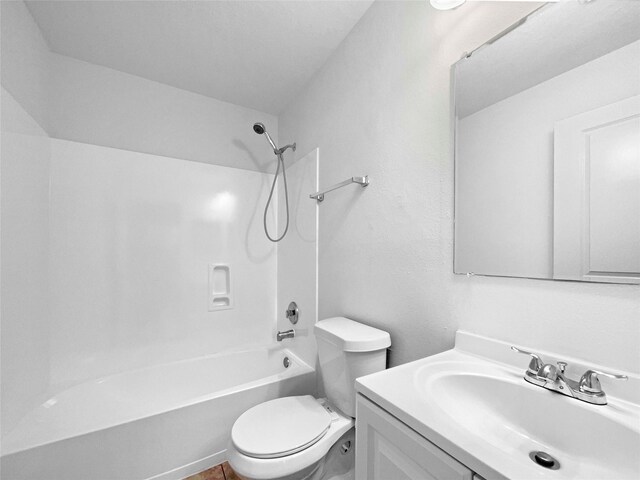 full bathroom featuring vanity,  shower combination, and toilet