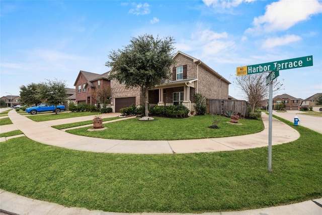 view of front of house featuring a garage and a front lawn