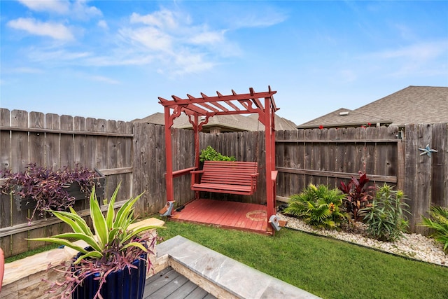 view of yard with a pergola and a wooden deck