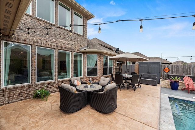 view of patio / terrace featuring a shed