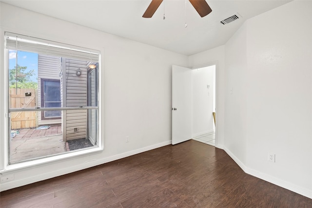 unfurnished room featuring dark hardwood / wood-style floors and ceiling fan