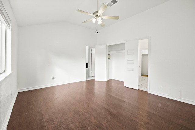 unfurnished bedroom featuring a closet, hardwood / wood-style flooring, vaulted ceiling, and ceiling fan