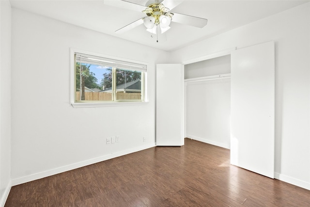 unfurnished bedroom with a closet, ceiling fan, and dark hardwood / wood-style flooring