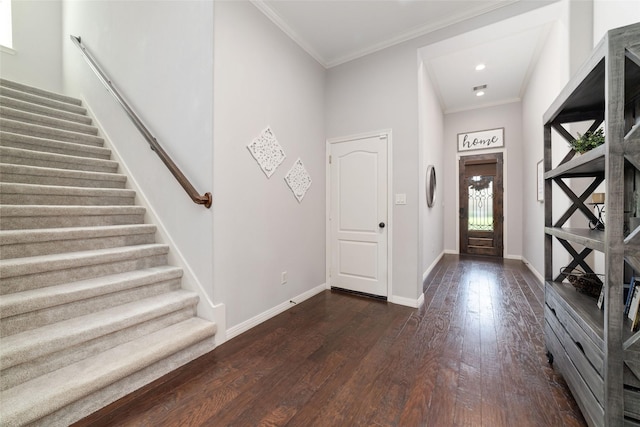 foyer featuring crown molding and dark hardwood / wood-style floors