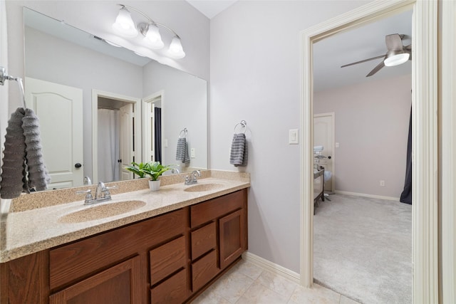 bathroom with ceiling fan, vanity, and tile patterned floors