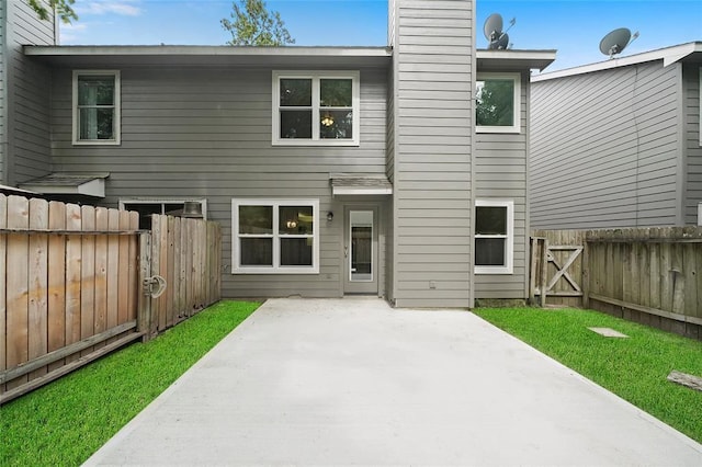 back of property featuring a patio area