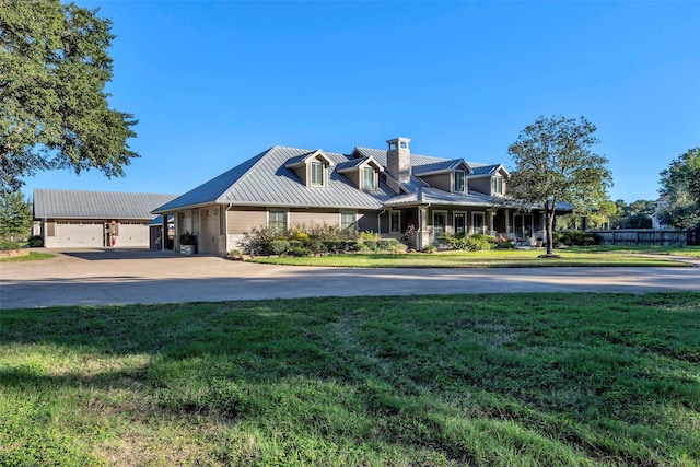 view of front of property featuring a garage and a front lawn