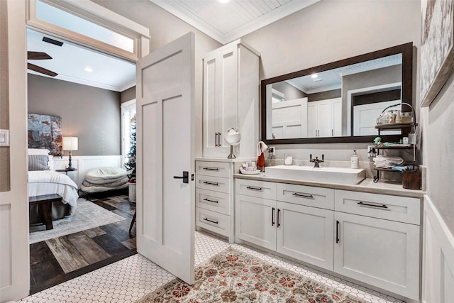 bathroom with vanity and ornamental molding