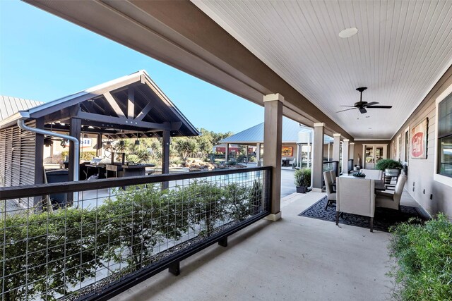 view of patio / terrace featuring a gazebo and ceiling fan