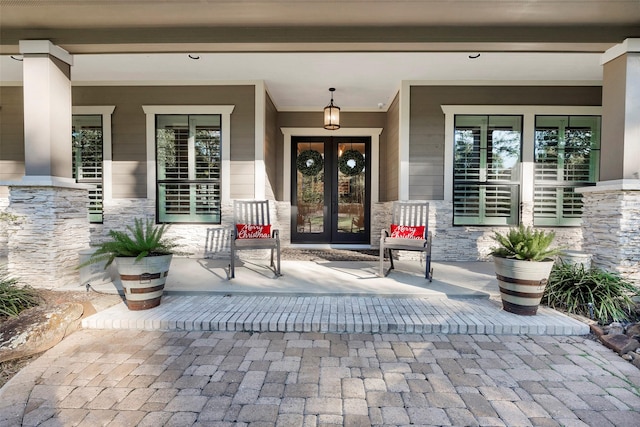 entrance to property with french doors and covered porch