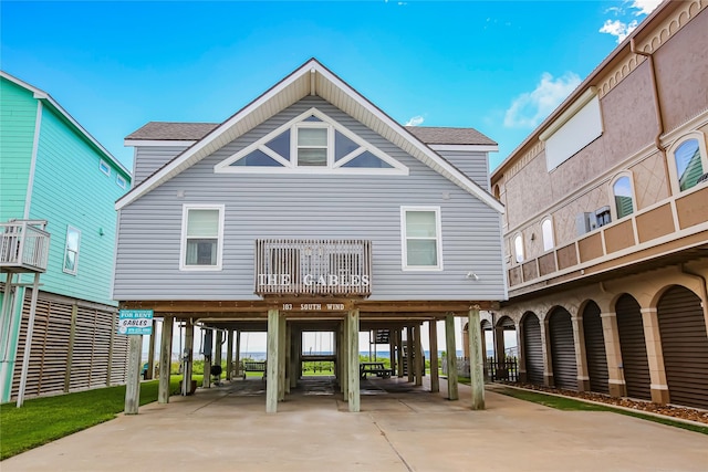 rear view of house featuring a carport