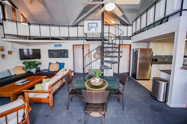103 Southwind Dr, Surfside Beach, TX 77541 - dining space with high vaulted ceiling, stairway, light colored carpet, a ceiling fan, and a wooden ceiling with exposed beams