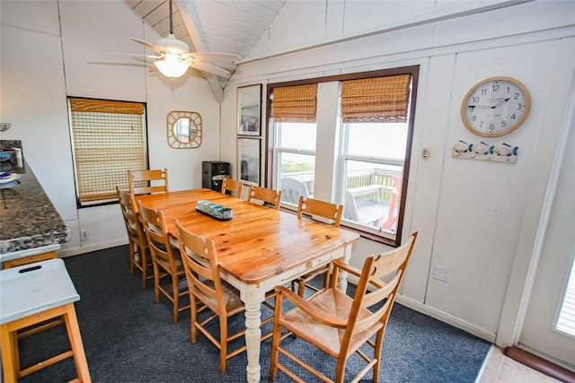 dining room with ceiling fan and vaulted ceiling