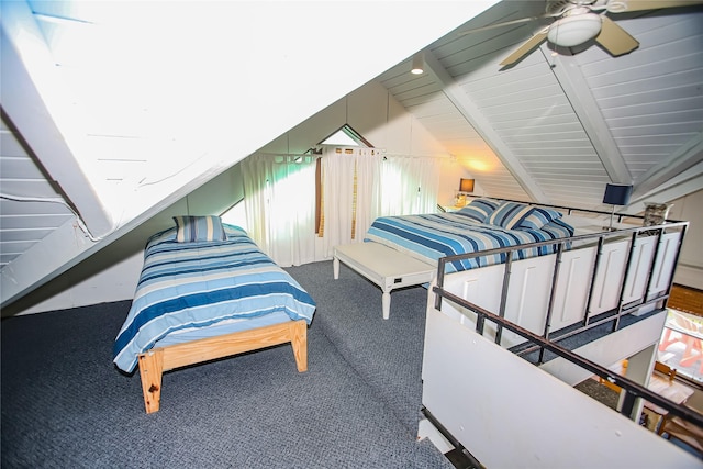 bedroom with carpet, lofted ceiling with beams, and ceiling fan