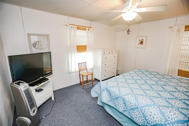 bedroom with dark carpet and ceiling fan