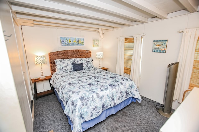 carpeted bedroom featuring beam ceiling