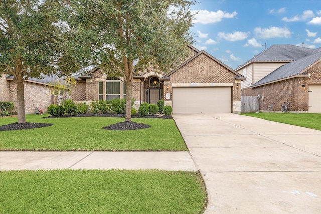 view of front facade with a front yard and a garage