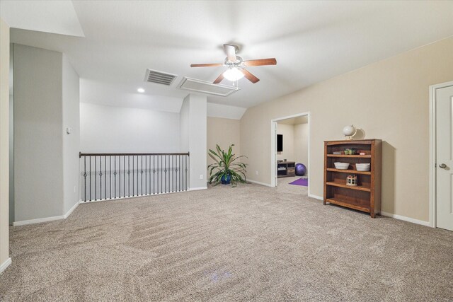 empty room with carpet, ceiling fan, and vaulted ceiling