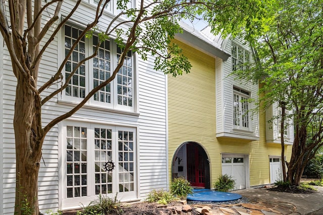 view of side of property featuring french doors