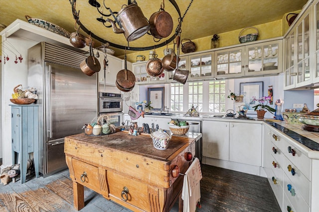 kitchen featuring sink, white cabinetry, and stainless steel appliances