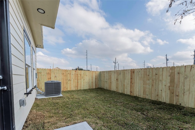 view of yard with central AC unit