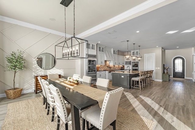 dining space featuring an inviting chandelier and dark hardwood / wood-style floors