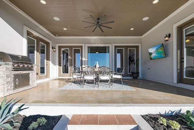 view of patio / terrace with area for grilling, ceiling fan, and exterior kitchen