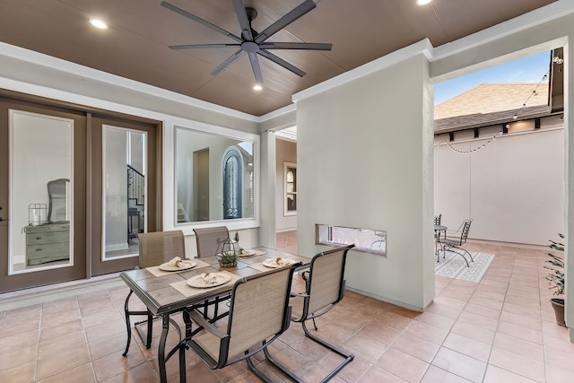 view of patio / terrace featuring outdoor dining area and a ceiling fan