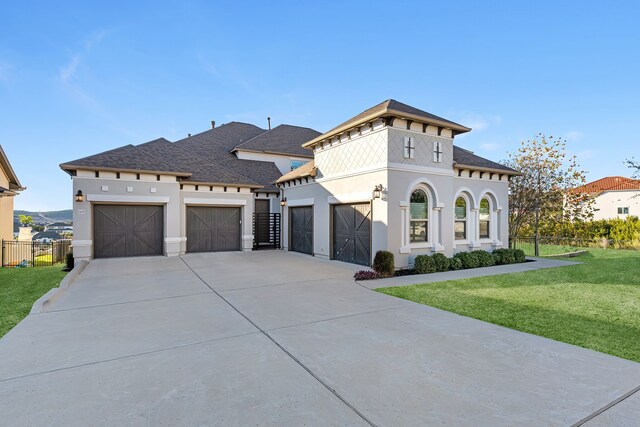 view of front facade with a garage and a front yard