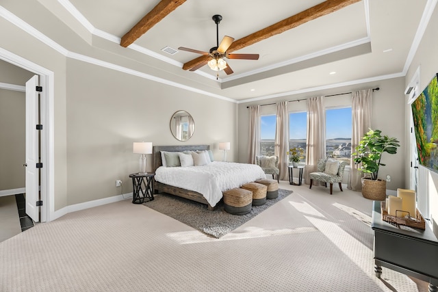 bedroom with baseboards, visible vents, light colored carpet, a tray ceiling, and crown molding