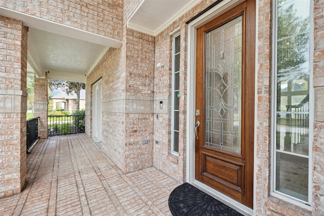 doorway to property with covered porch