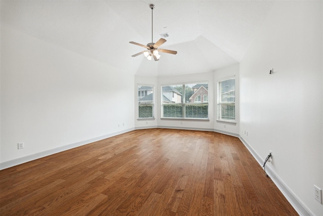 empty room with hardwood / wood-style floors, ceiling fan, and lofted ceiling