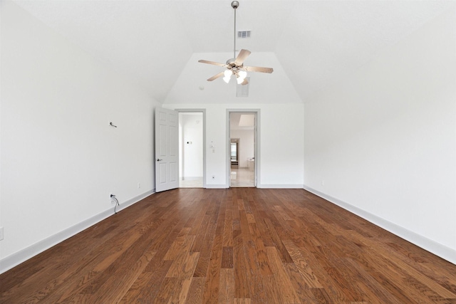 unfurnished living room featuring ceiling fan, dark hardwood / wood-style flooring, and vaulted ceiling