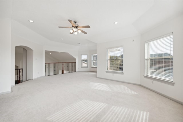 carpeted spare room featuring ceiling fan