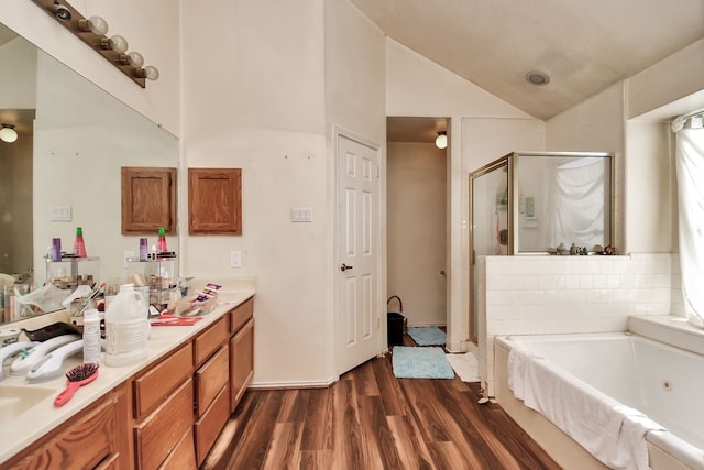 bathroom with wood-type flooring, vanity, shower with separate bathtub, and lofted ceiling