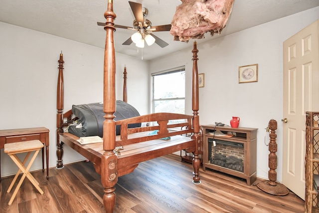 bedroom with ceiling fan and wood-type flooring