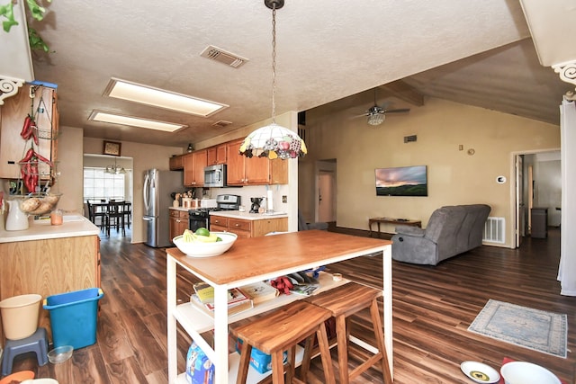 dining room with ceiling fan, dark hardwood / wood-style floors, a textured ceiling, and lofted ceiling with beams