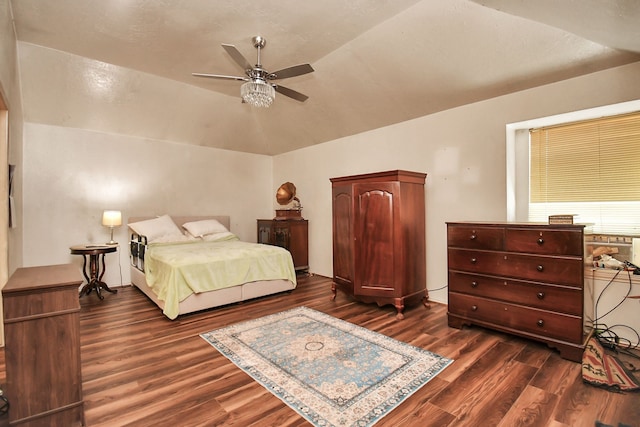 bedroom featuring vaulted ceiling, ceiling fan, and dark wood-type flooring