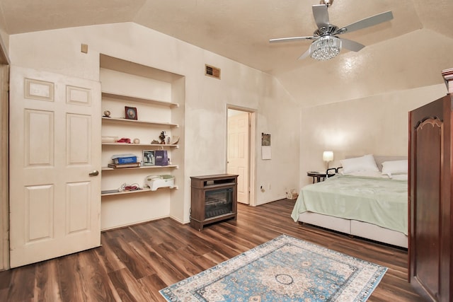 bedroom featuring ceiling fan, dark wood-type flooring, and vaulted ceiling