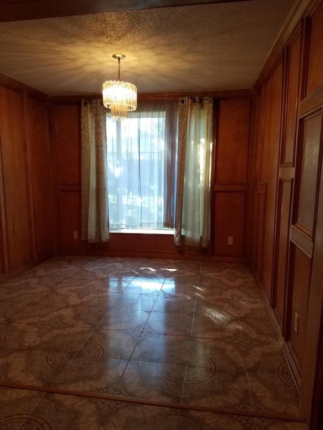 unfurnished dining area featuring a chandelier