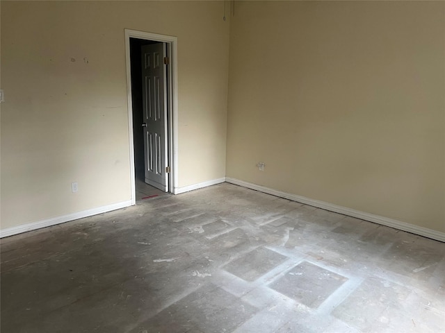 spare room with concrete flooring