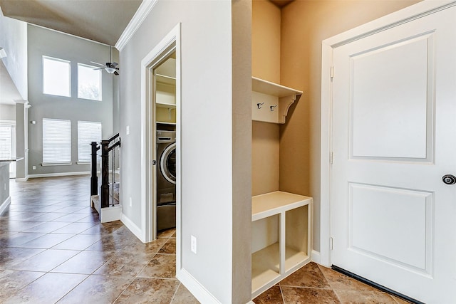 mudroom featuring ceiling fan, light tile patterned floors, crown molding, and washer / clothes dryer